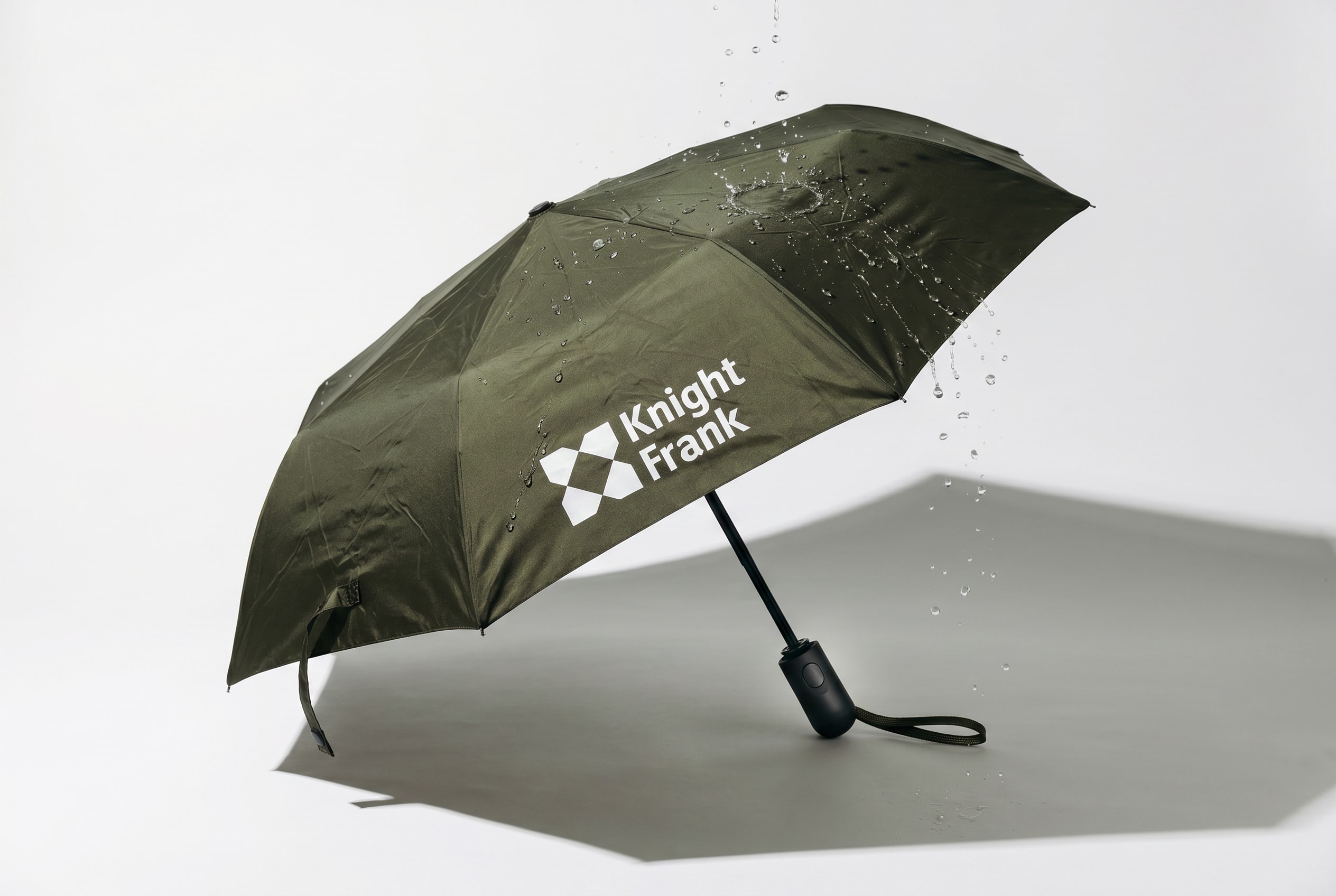 Knight Frank umbrella photographed in the rain