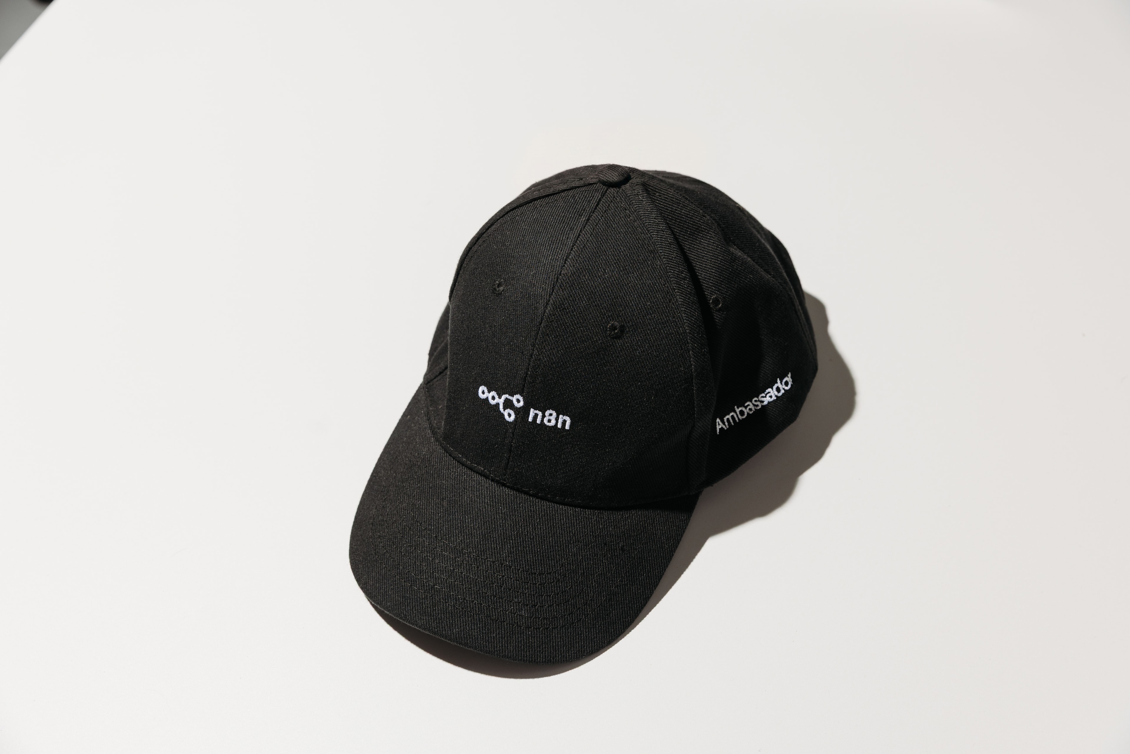A black n8n Ambassador cap with white embroidery